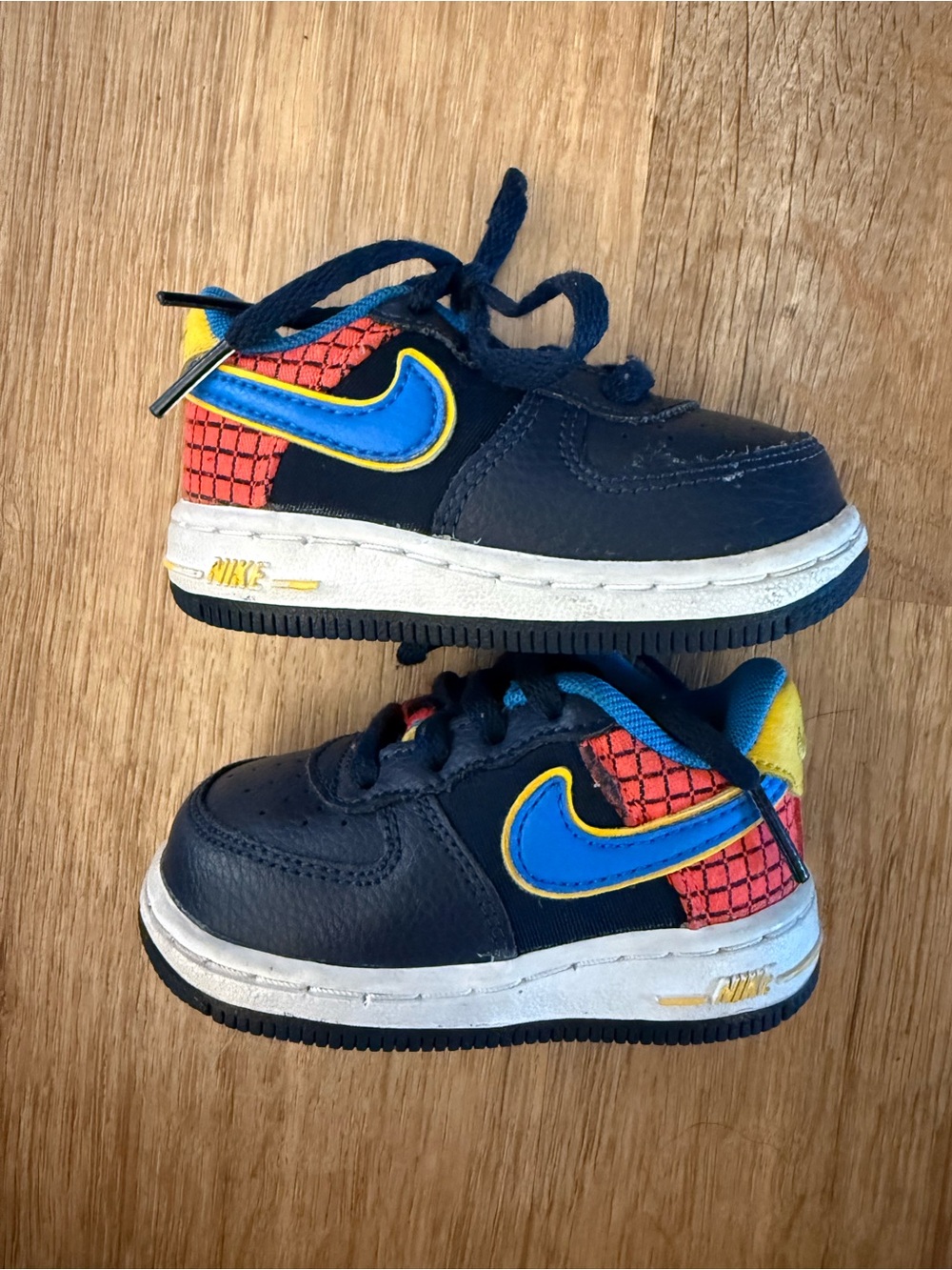 Nike Kids Navy, Blue & Yellow Swoosh Sneakers with Red Grid Accent